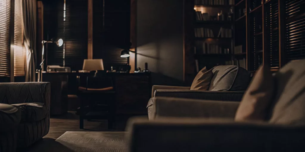 Professional law office with warm lighting conveying safety and support for survivors seeking legal help